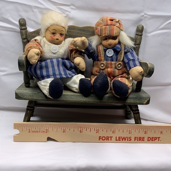 Grandma and grandpa sitting on a wooden bench - Picture 4 of 6